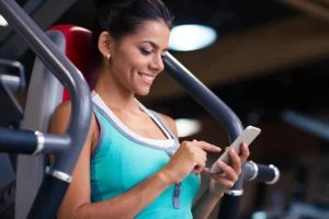 excited woman using a free fitness app